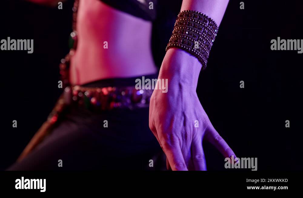 traditional belly dance, woman is wearing arabian or indian suit is