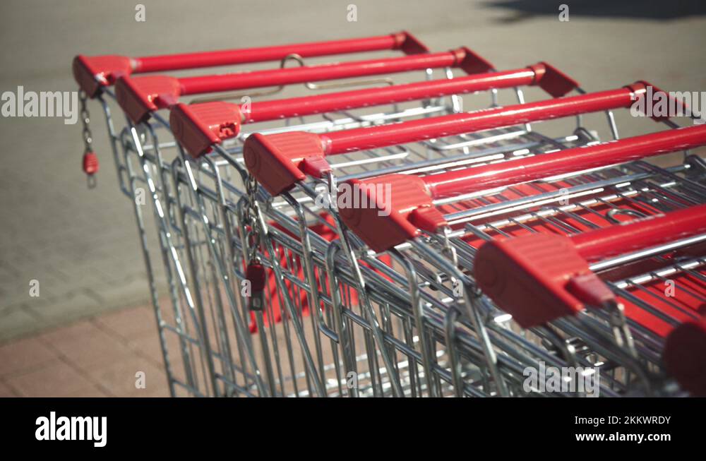 Red shopping carts lined up outside locked up due to store closures