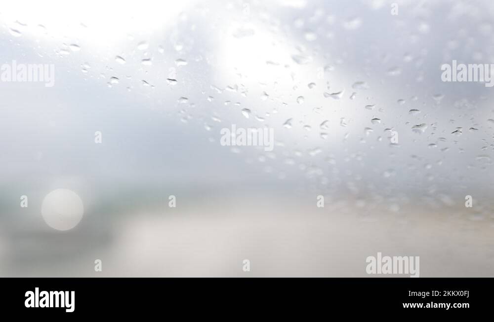 Raindrops on the windshield of a car, the street is out of focus Stock ...
