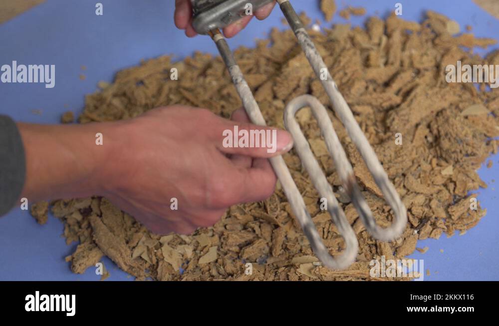 Calcium deposits are hard mineral deposits that latch on to your heating element Stock Video