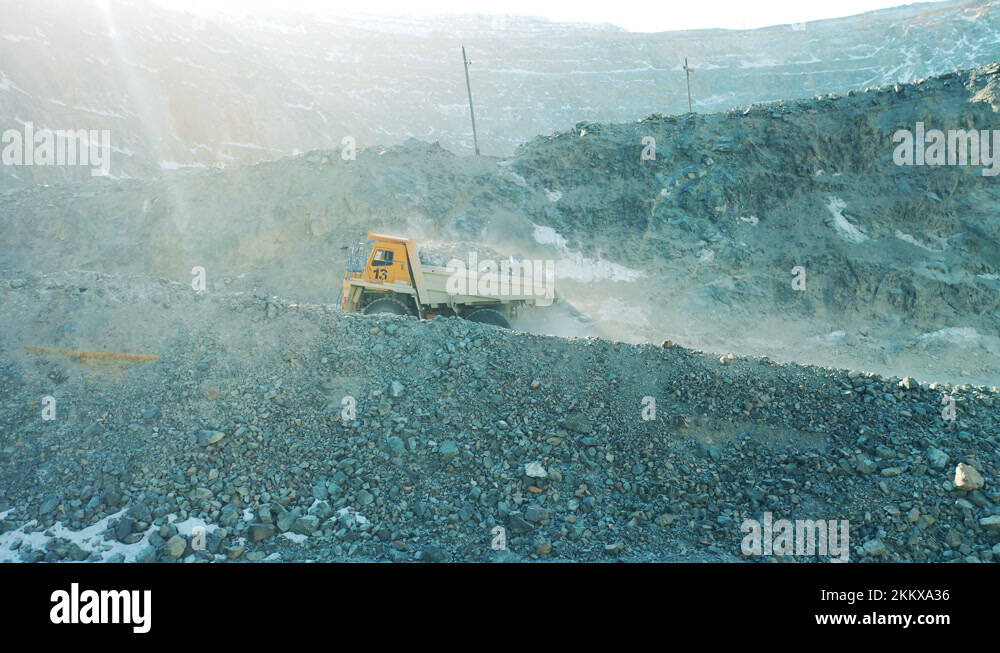 Quarry Riding Loaded truck is riding along the slopes of the mine site. Quarry ...