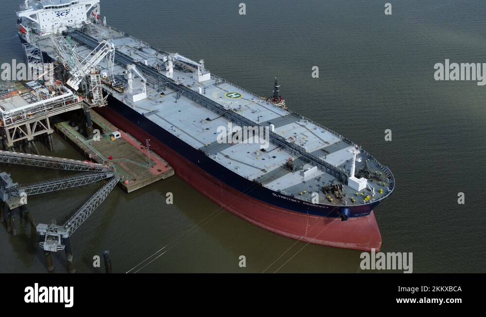 Crude oil tanker ship loading at refinery harbour terminal aerial view Stock Video Footage Alamy