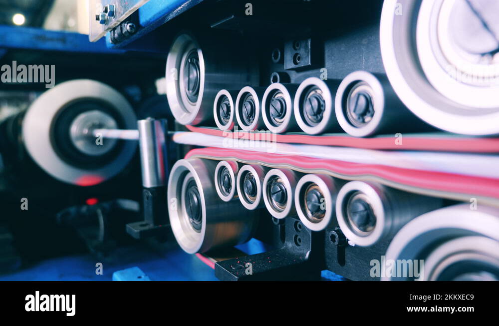 Cable insulation process at a cable manufacturing facility. Automated industrial Stock Video