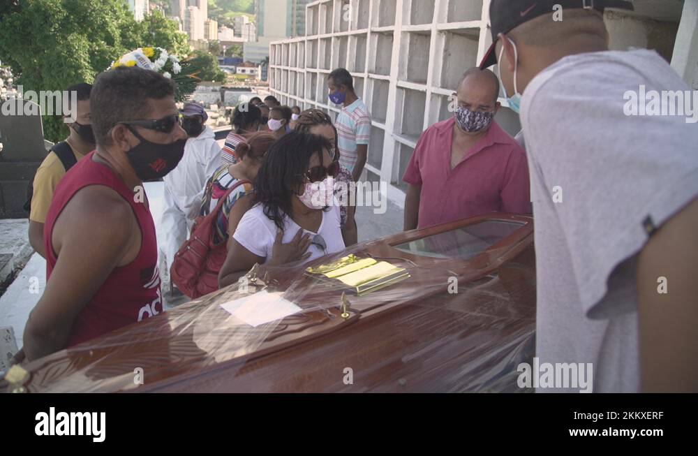 Grieving family pay their respects to their loved one's casket before Stock Video Footage Alamy