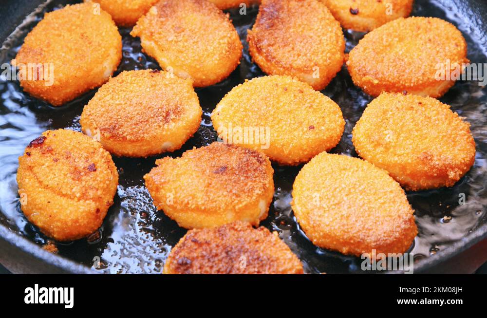 Crispy chicken nuggets frying in UHD Stock Video Footage Alamy
