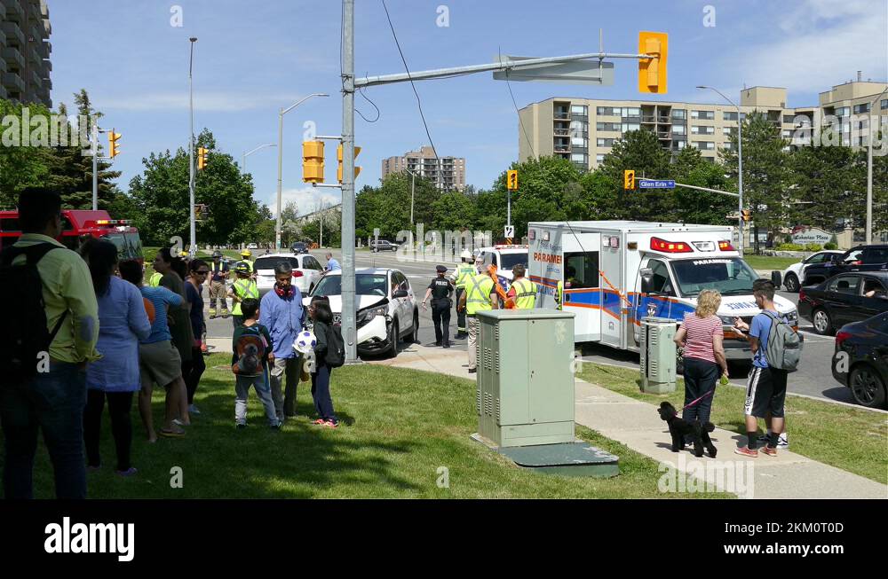 Paramedics and emergency vehicles at a car crash, Mississauga, Canada