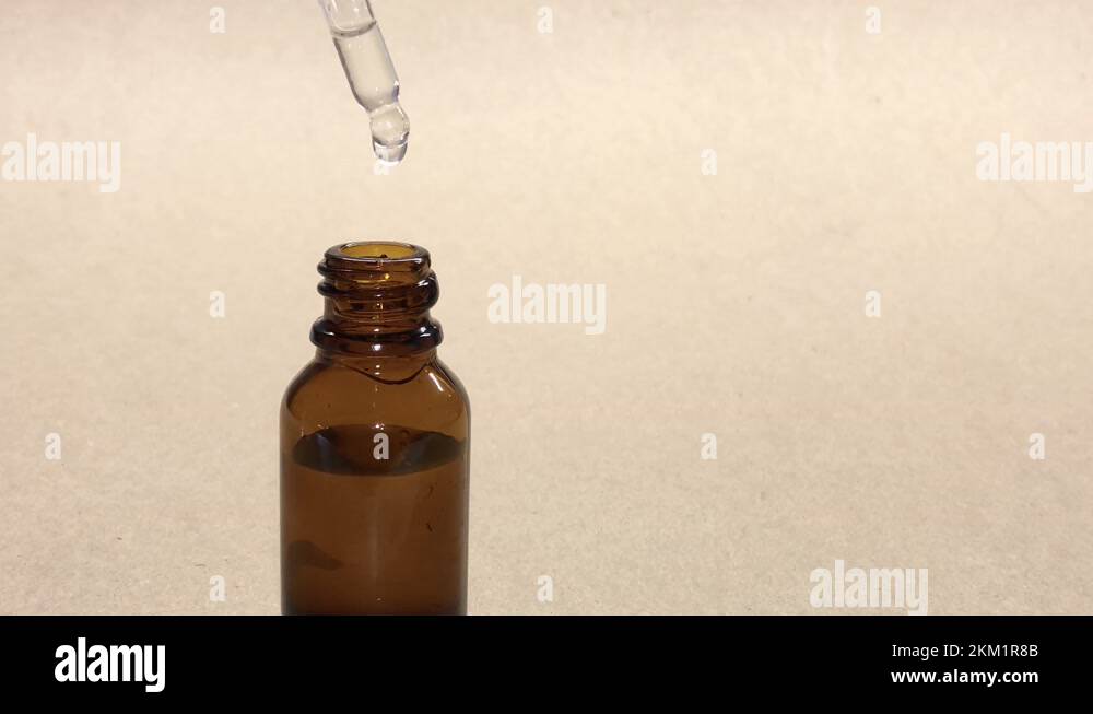 Closeup of using facial moisturizer. woman dripping from a pipette