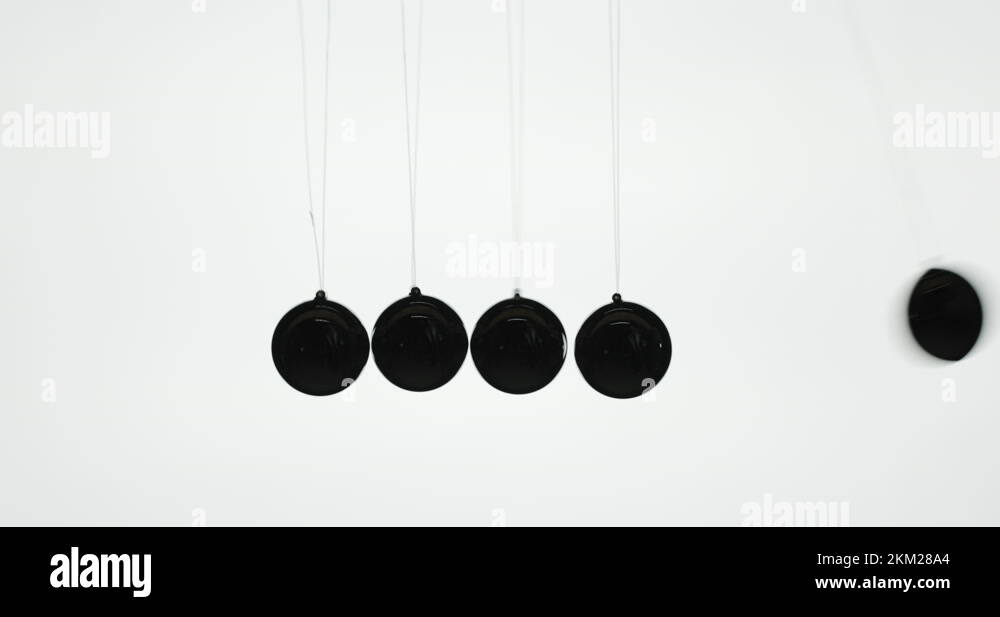 Balls in Newton's pendulum hit each other demonstrating energy