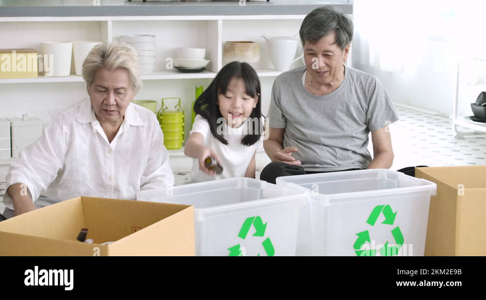 Sorting Garbage Child Grandparents teaching their child sorting garbage for recycling Stock ...