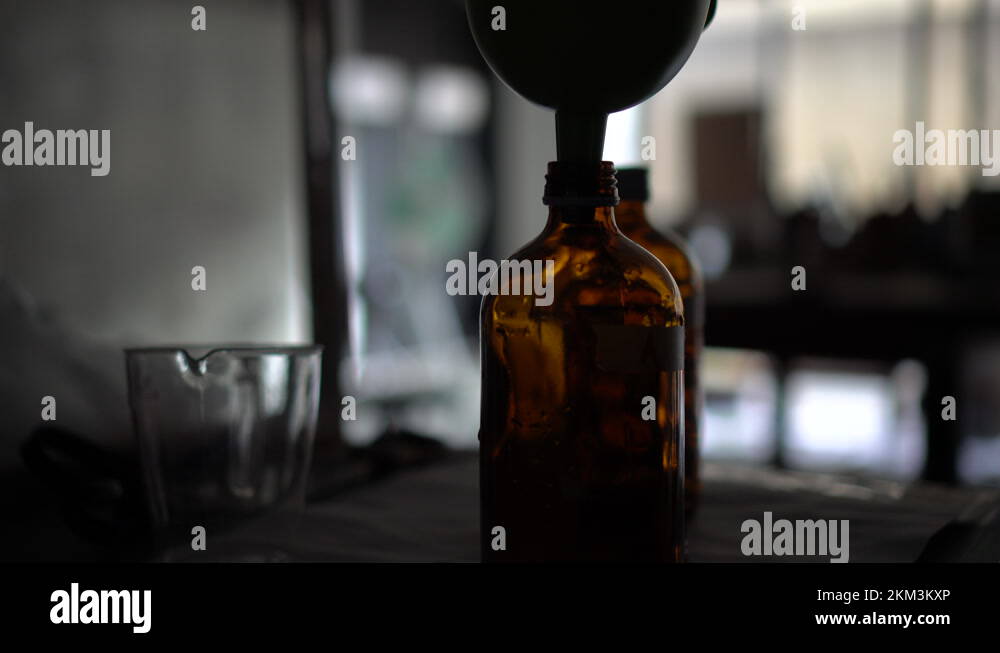 Cyanotype process of mixing chemical in dark room for print making art