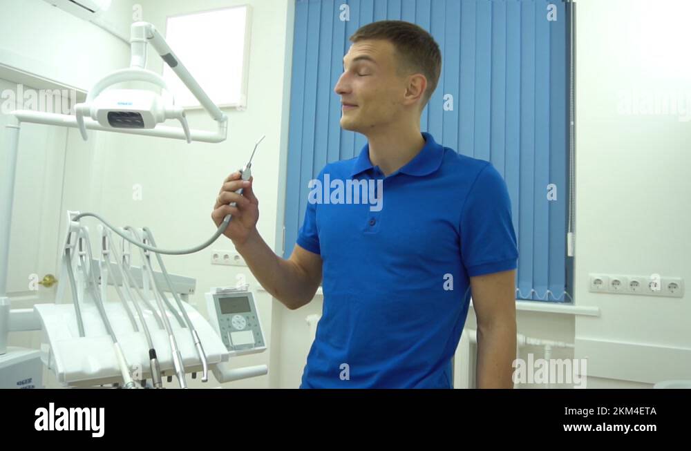 Dentist play with compressed nozzle air and saliva ejector