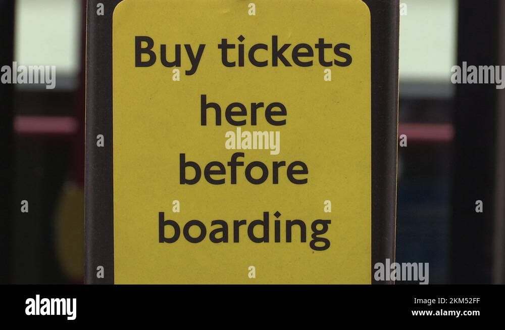 Buy tickets here before boarding' sign for buses Stock Video Footage ...