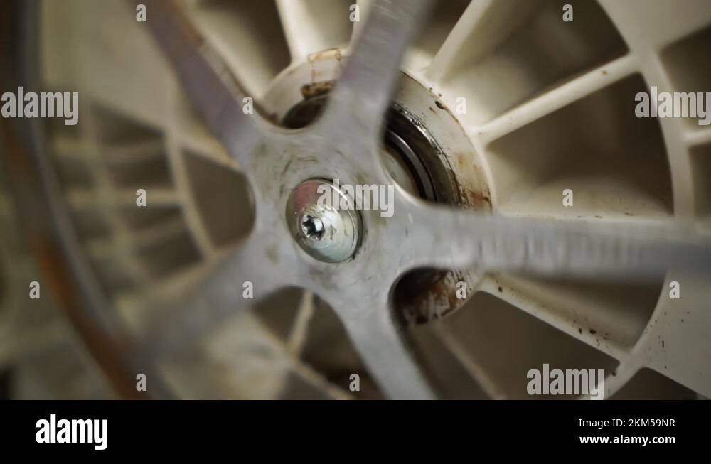 Washing machine drum bearing failure leaking with rust and scale