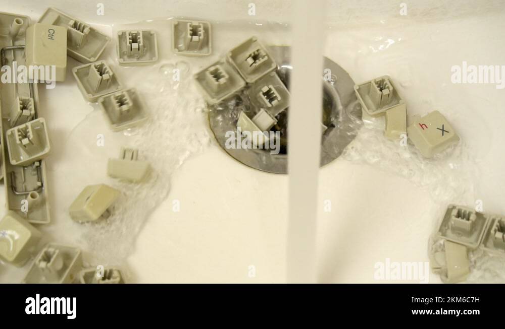 Repair and renovation of a computer keyboard. The keys are washed in