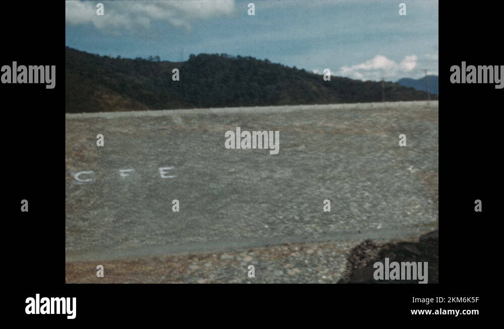 1960s: Landfill along dam with letters CFE written on ground. Landfill ...