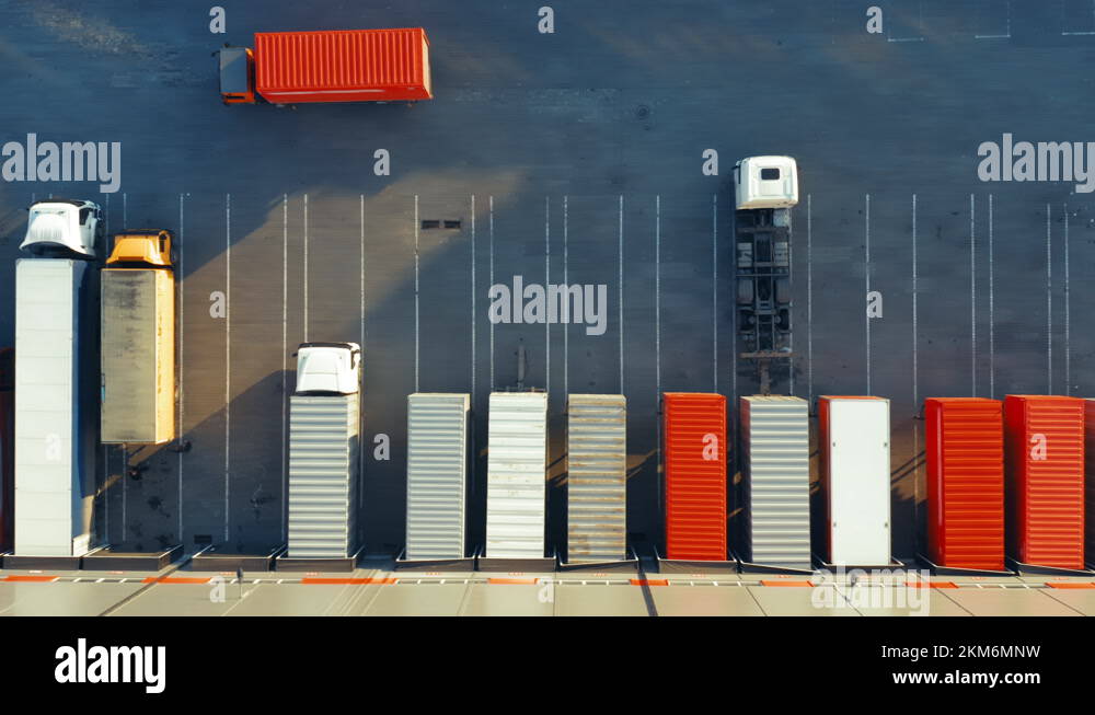Semitrailers trucks stand at warehouse ramps for load / unload goods