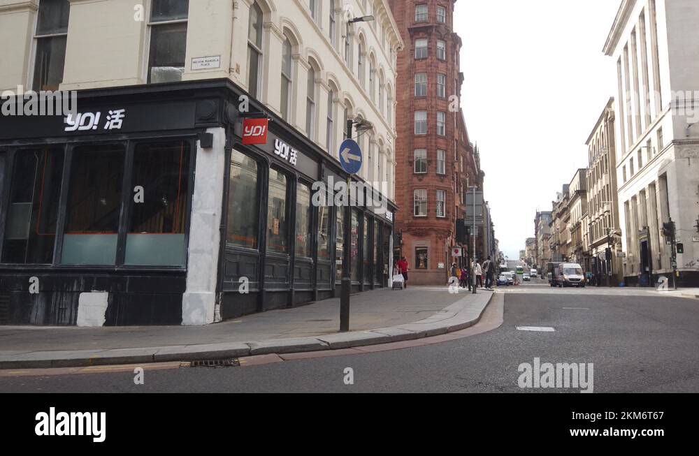A delivery man with parcels in a quiet city centre Stock Video Footage