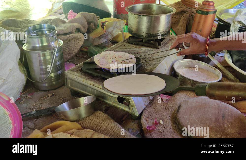 4K Making fresh chapatis on a gas stove using a tong Stock Video