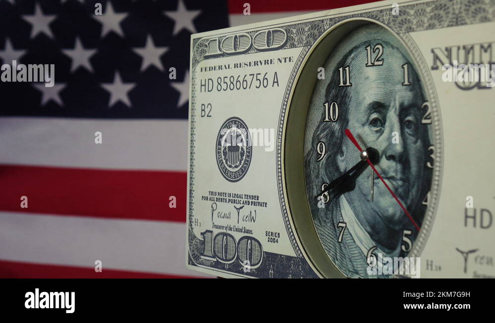 100-dollar-bill-in-the-form-of-a-watch-on-the-background-of-the-us