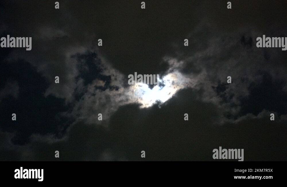 Bright White Full Moon In Cloudy Night Sky Illuminating Clouds 002 ...