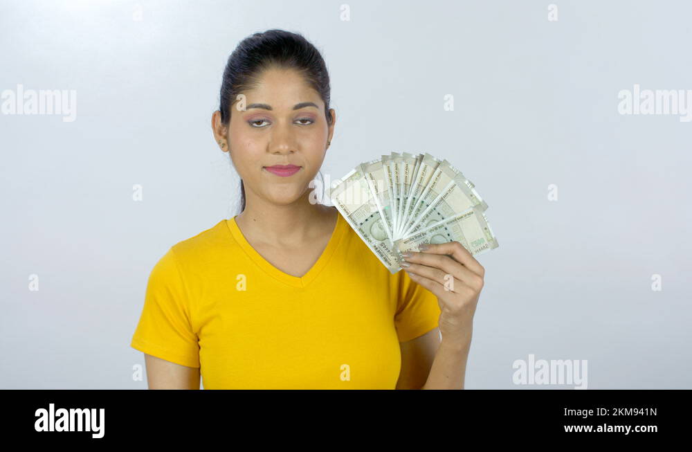 Young Indian Girl Proudly Showing Her Last Month's Salary - Financial 