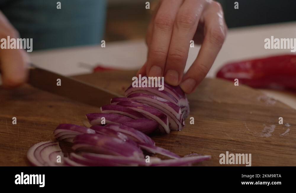 Cutting the onion into slices. Woman cut red onion Stock Video Footage Alamy
