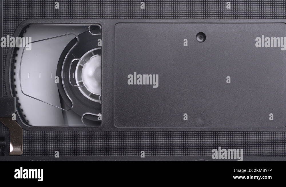VHS video cassette inserting in the VCR, play, stop, eject, close up