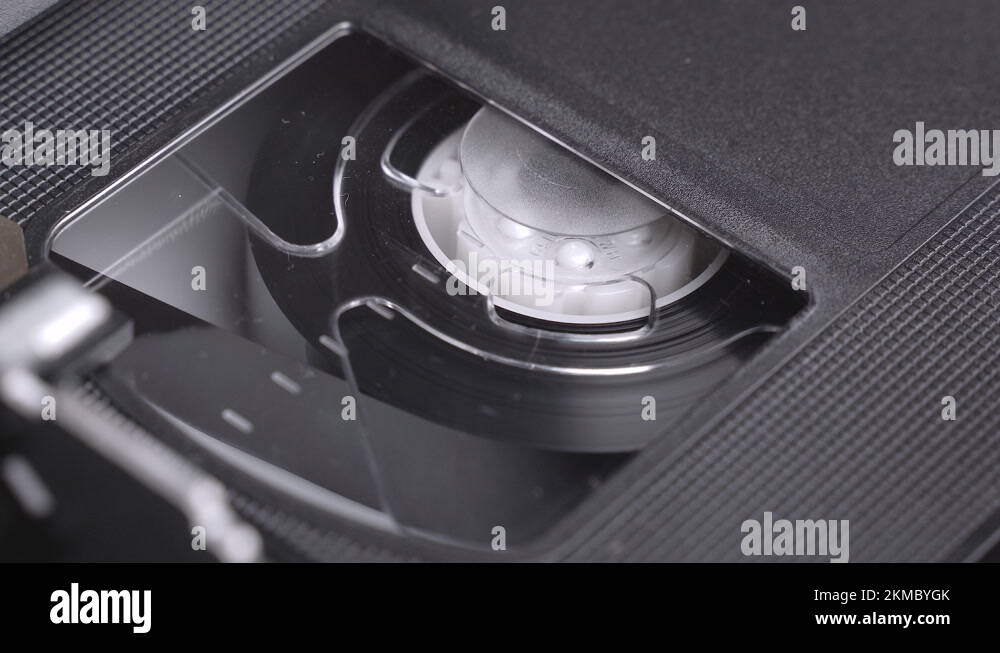 VHS video cassette inserting in the VCR, play, stop, eject, close up