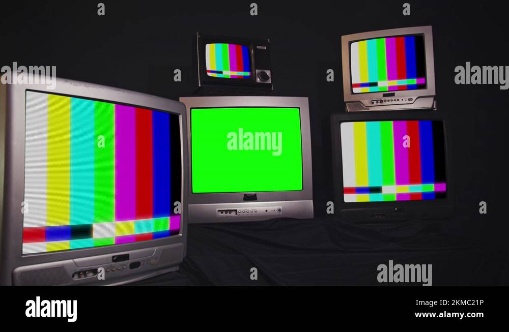 Stack of Retro Vintage TV Turning On Green Screens. You can replace