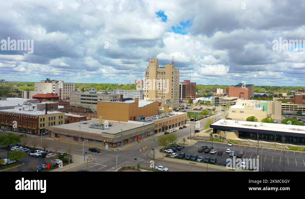 Good drone aerial of downtown Flint, Michigan with old buildings and empty lots Stock Video
