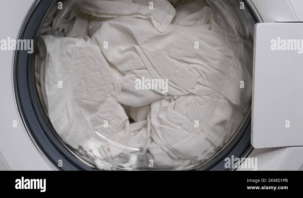 Washing clothes in a washing machine. The laundry is washed Stock Video