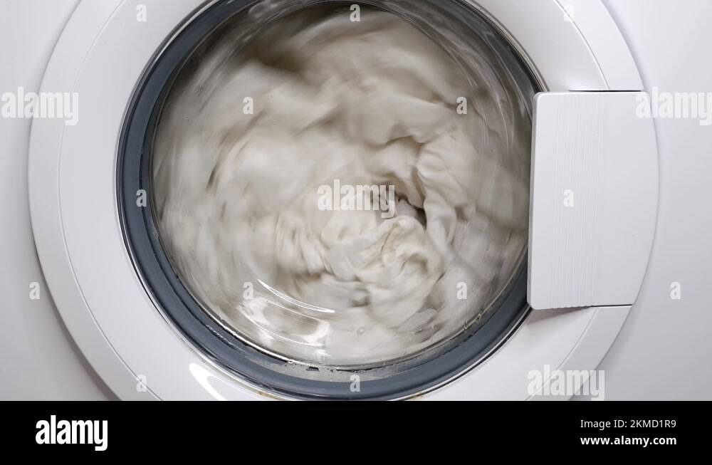 washing clothes in a washing machine Stock Video Footage - Alamy