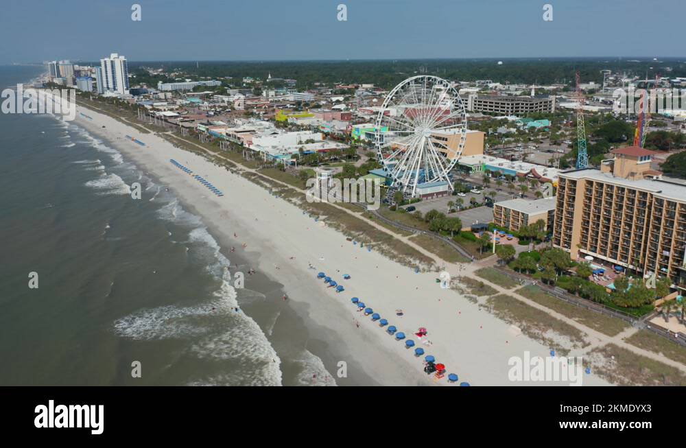 Wide aerial of Myrtle Beach South Carolina oceanfront shoreline. Atlantic Stock Video Footage