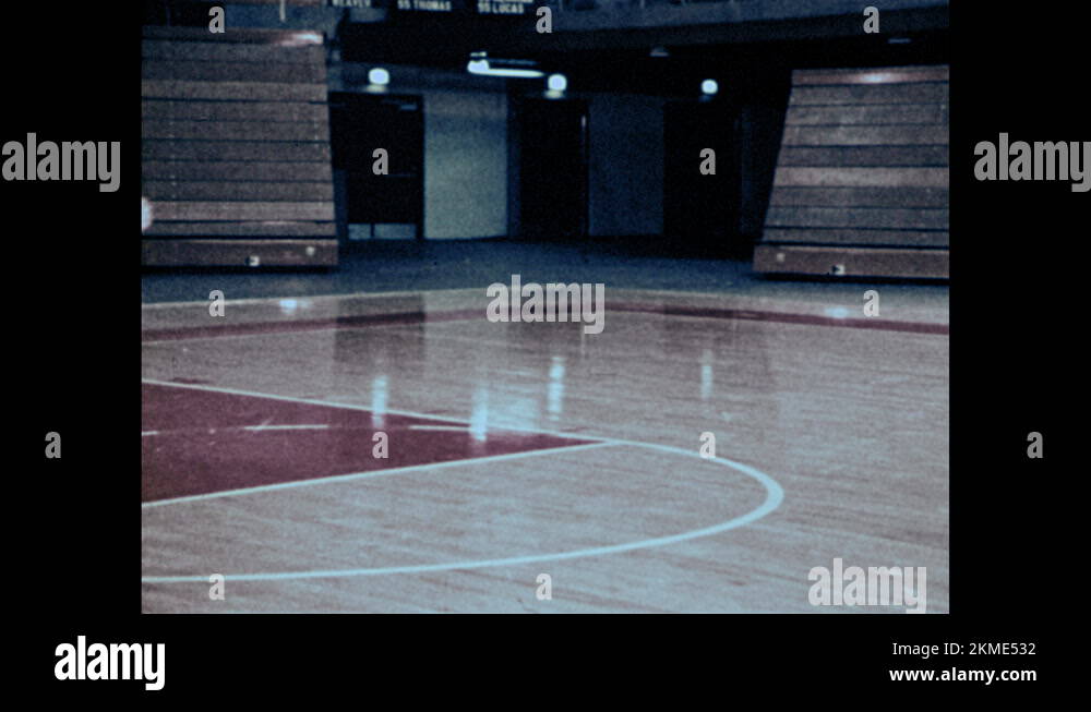 1970s Shots of girls playing basketball in gym. Girl shoots ball in