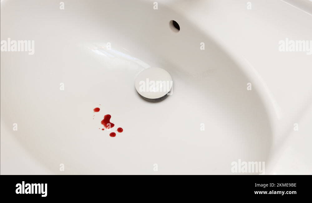 Splashes of blood dripping into the sink in the bathroom. Dripping ...