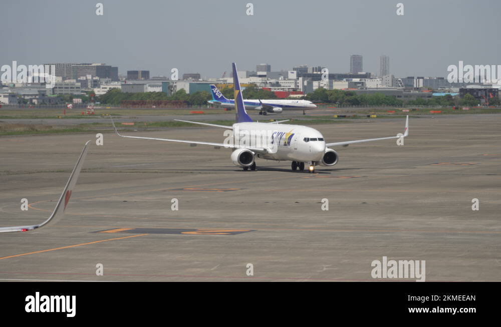 Skymark Boeing 737800 Making A Turn At Apron Of Haneda Airport In