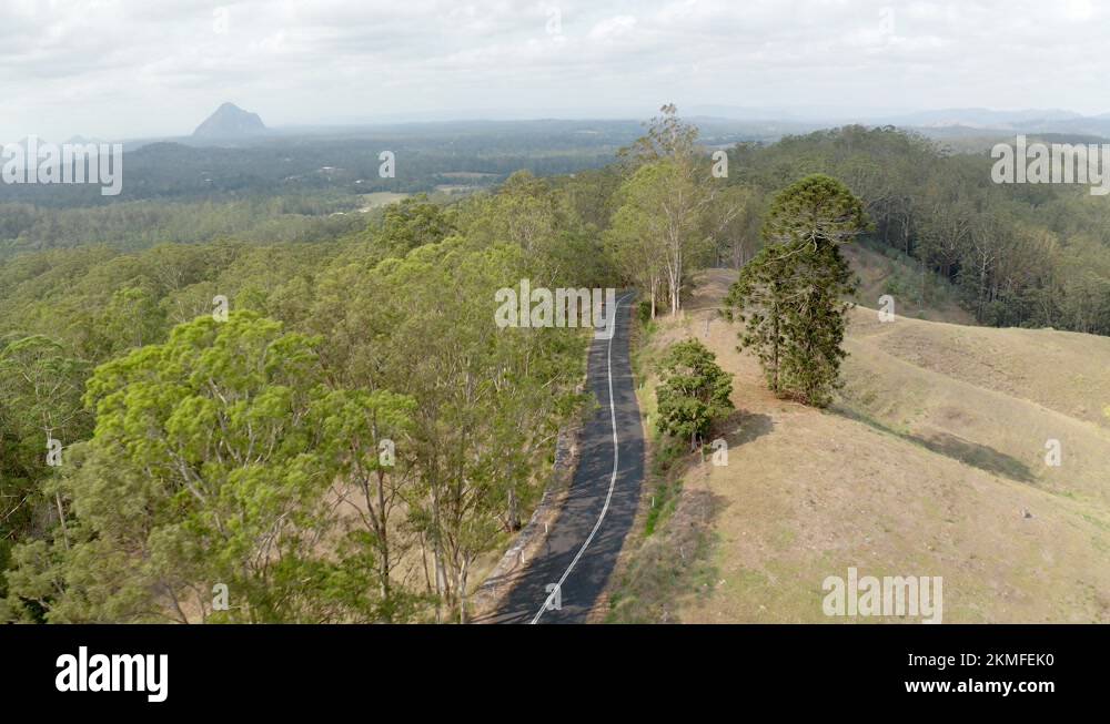 Asphalt Road At Glass House Mountains National Park Overlooking The