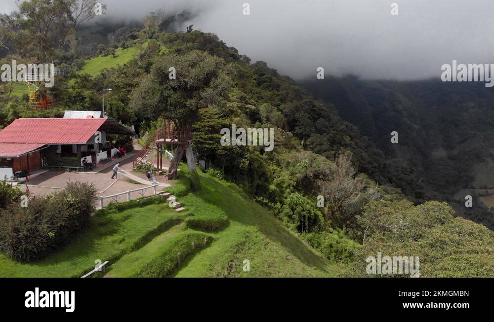 Swinging in the Clouds in Baños de Ambato, Ecuador. Tree house swing in