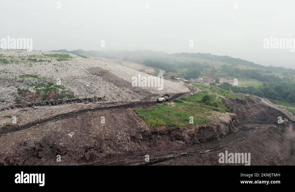 A pile of household trash with soil. Garbage landfill, top view Stock