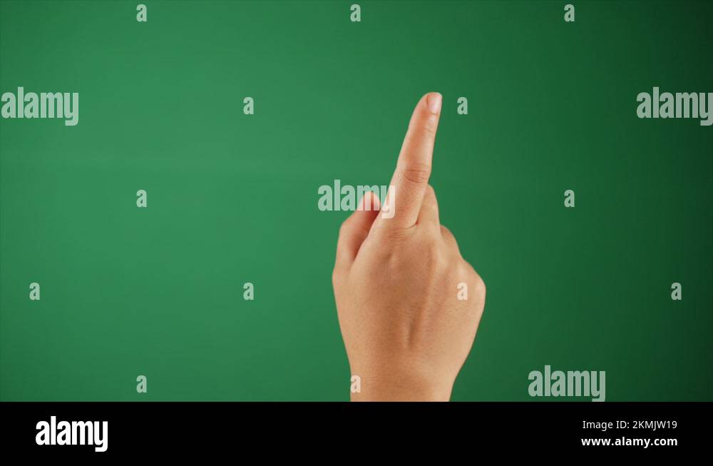 A person rotating the index finger against a green background hand