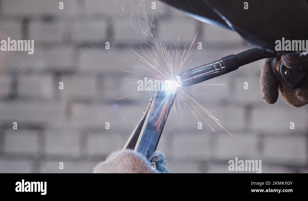 Process of welding two parts of the detail together glow and sparkles