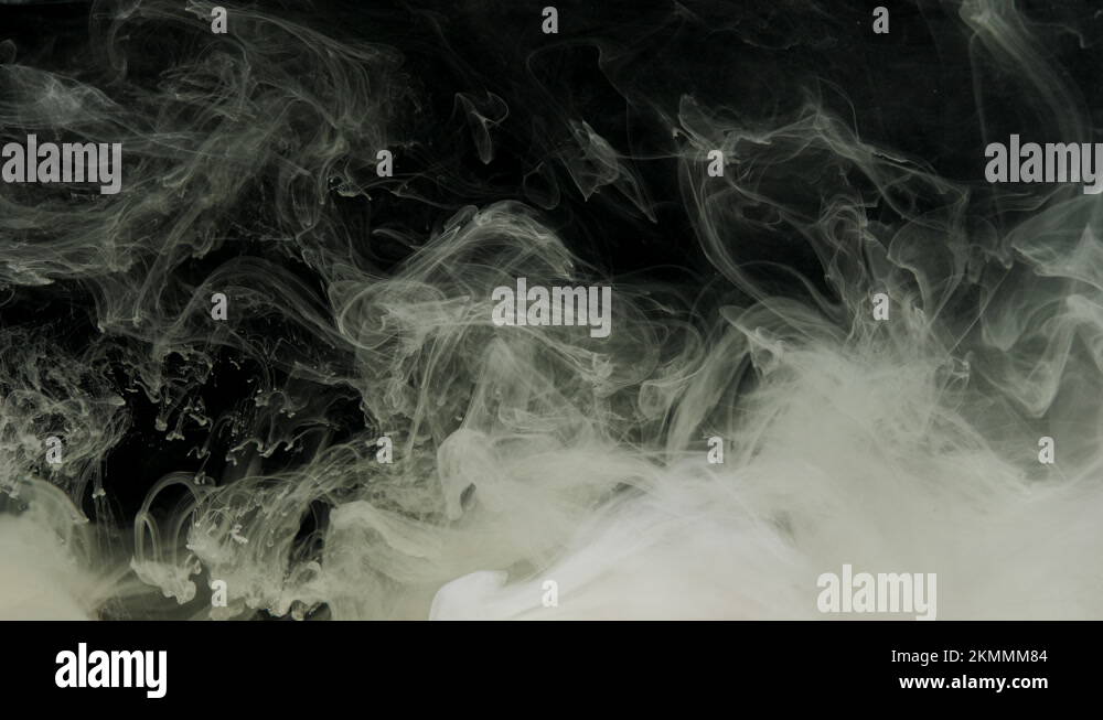 Gray ink acrylic paint mixing in water, swirling softly underwater in