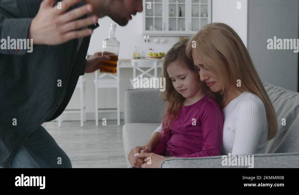 Alcohol addiction and family issues. Aggressive drunk man shouting at