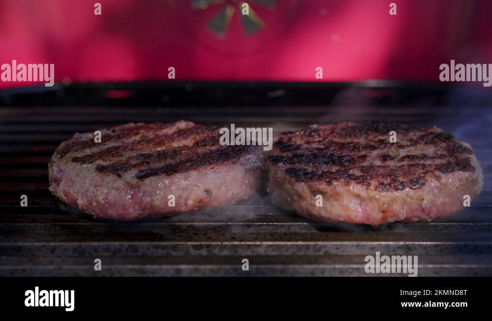 Juicy for beef Burger Patty is grilled over high heat on grate grill in