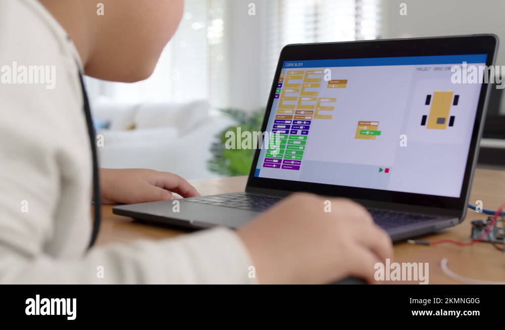 Asian kid make scratch robot car programming at home STEM study online ...