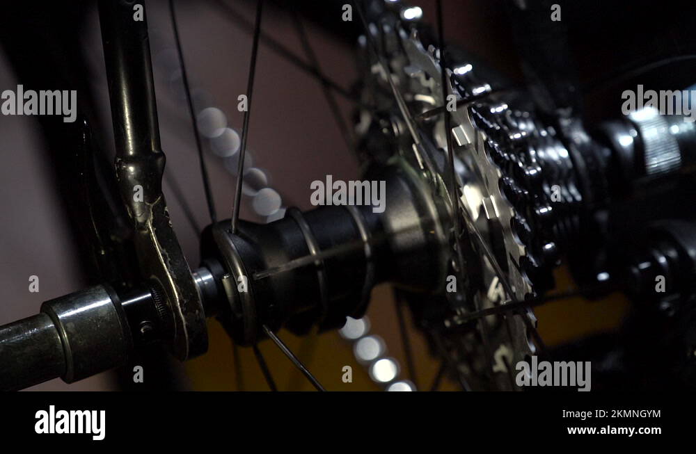 Part of bike with wheel cogwheel is rotating with chain and changing