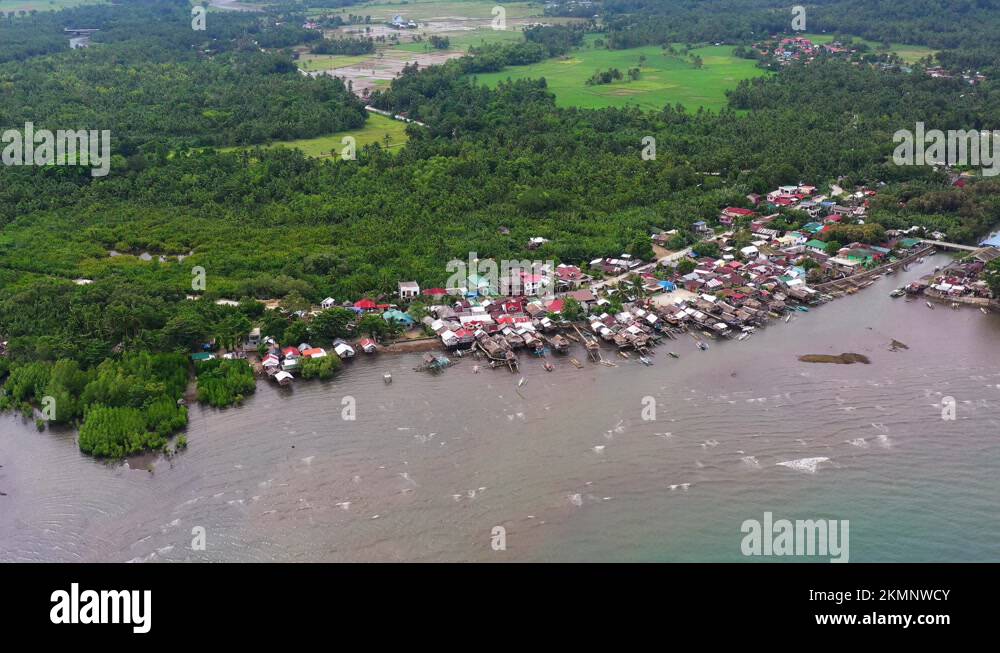 Dense Forest With Coastal Settlement On Saint Bernard In Southern Leyte