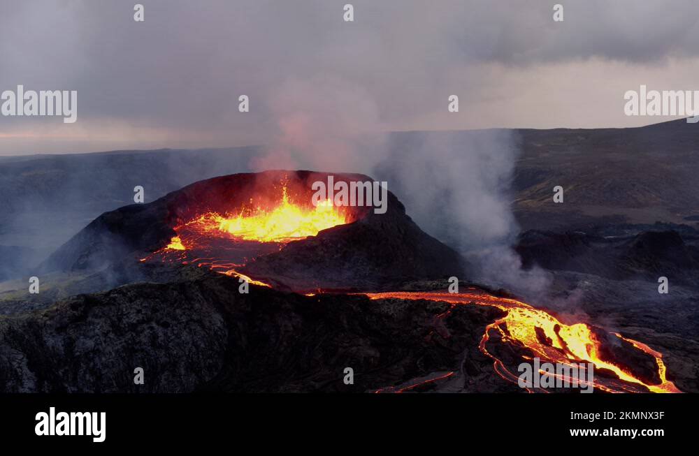 Hot Lava and Magma coming out of the Crater during Volcanic Eruption Stock Video Footage Alamy