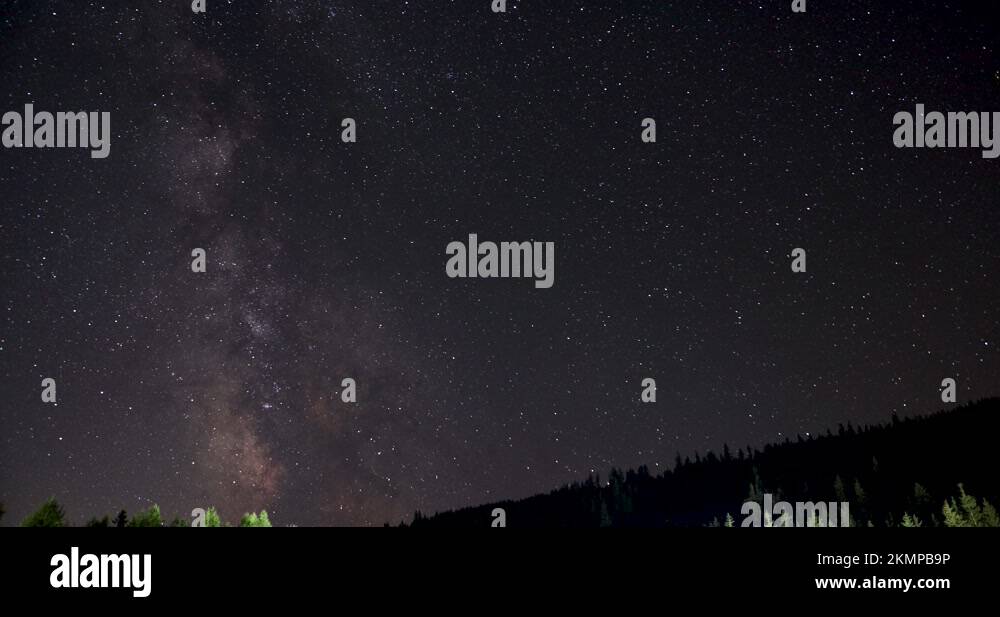 Milky Way With Magellanic Clouds In The Night Sky Over Forest Mountain ...