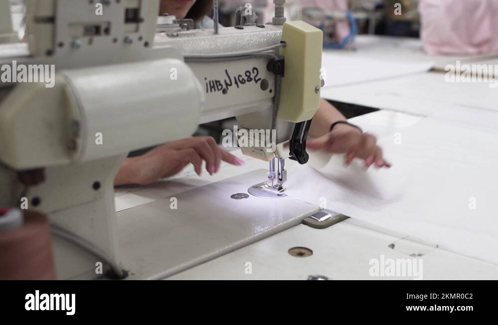 Female Dressmaker Working In Woman Tailor Making Clothes In